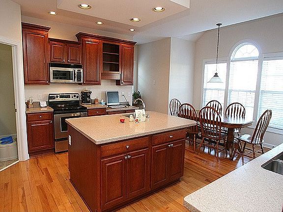 Center island, lots of cabinet space, more counter space.