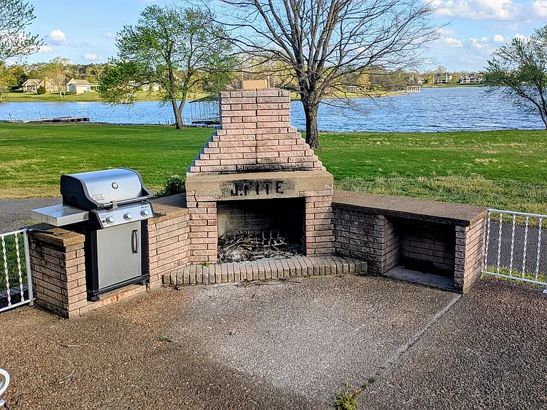 A gorgeous built-in fireplace and grill.