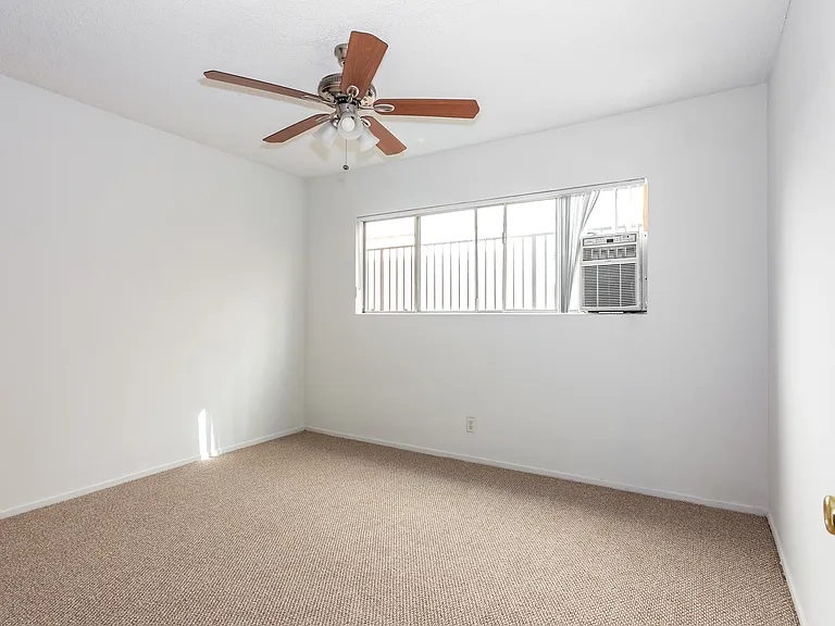 Bedroom #2. All bedrooms have brand new berber carpet, private window A/C unit and very large closets. Ceiling fan with lights.
