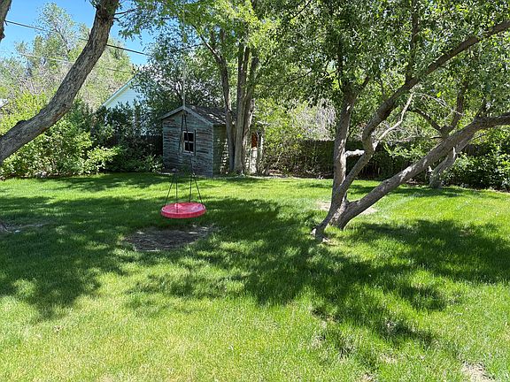 Backyard with mature trees.