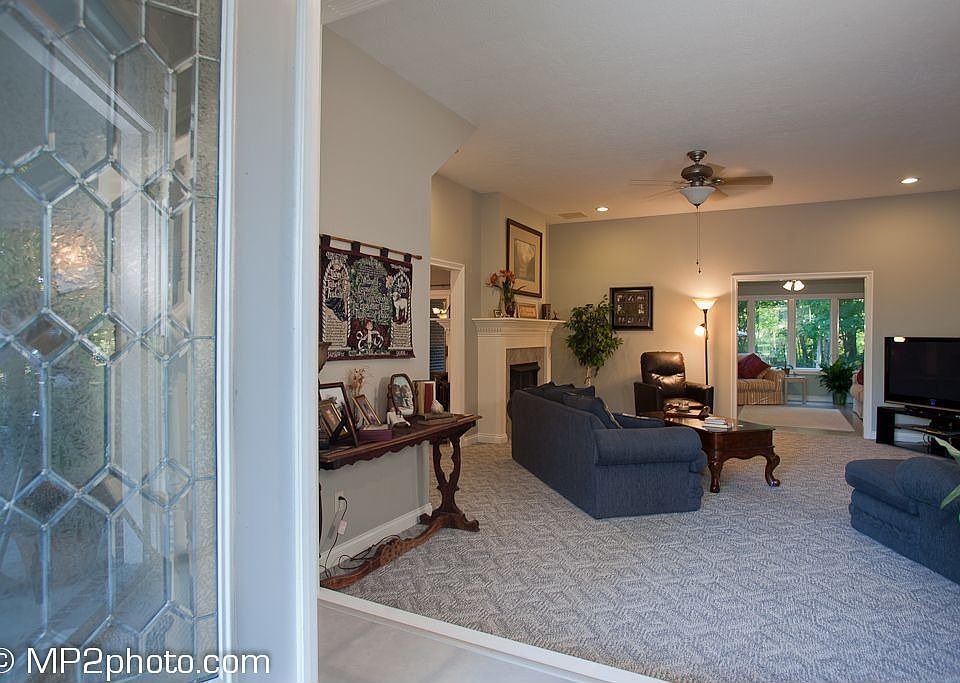 View from front door looking through living room into all-weather room