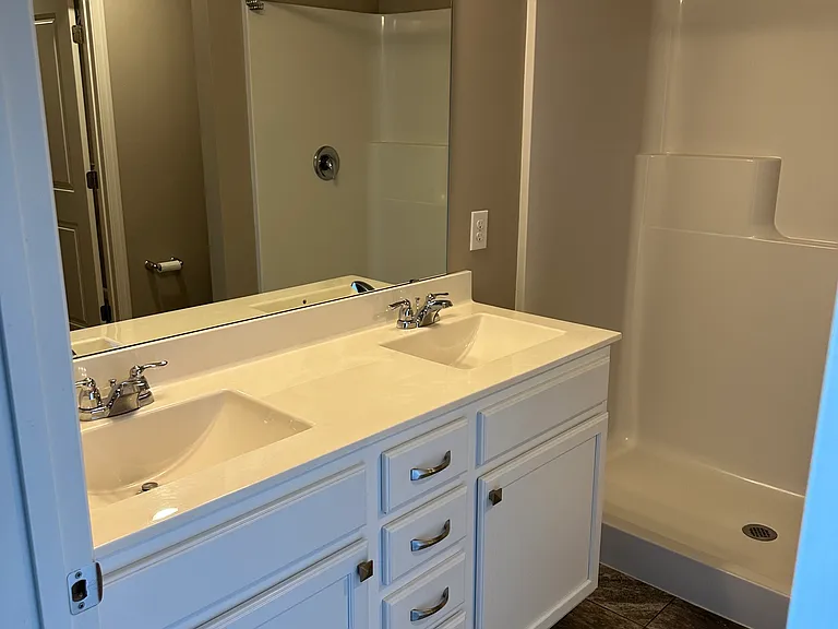 3/4 bathroom connected to primary bedroom.