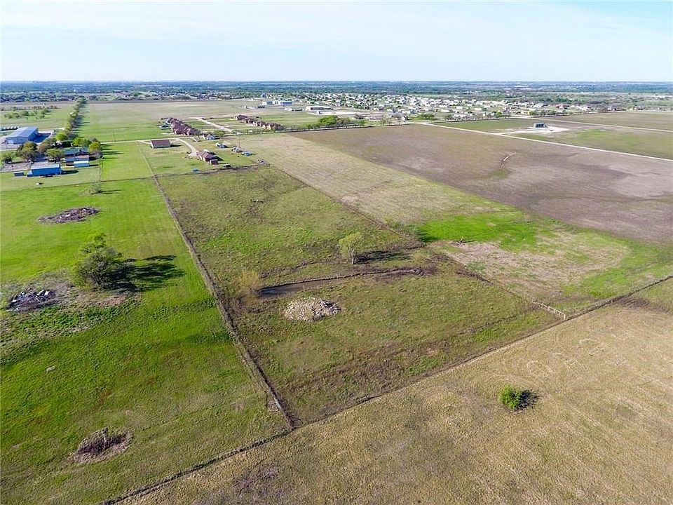 This is the aerial view showing the entire 8.255 acres with the small creek running along the back side.