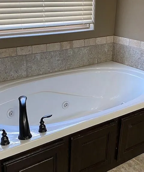 Spacious jetted bathtub.