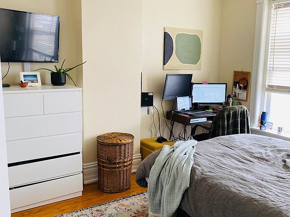 Bright master bedroom with two windows. Large enough for a desk, king bed, and dresser.