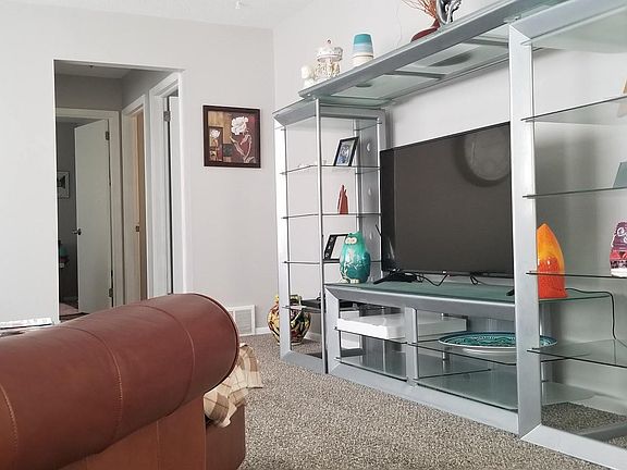 Hallway to three bedrooms on main level and full bath.