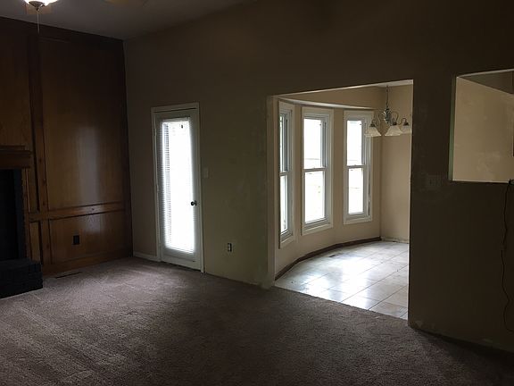 Living room opens to kitchen
