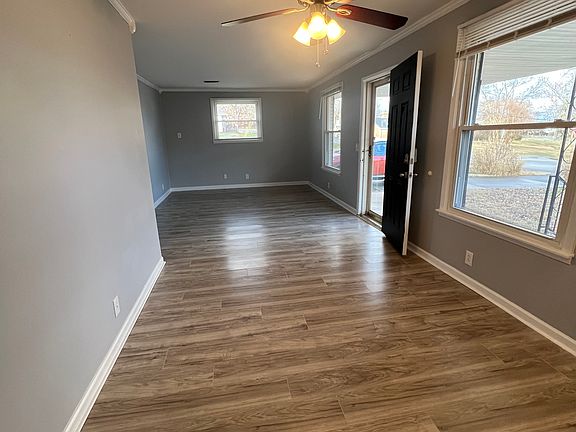 View of dining room and living room. Living room is wider and has more room for furniture.
