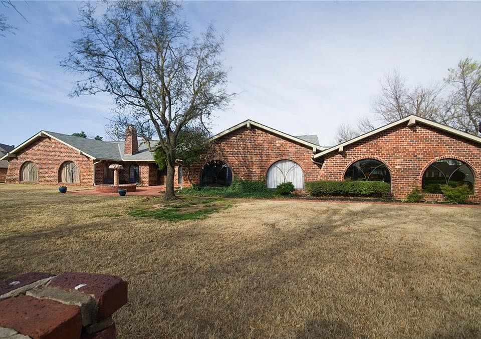 Lovely three bedroom home on a double lot on the The Greens Golf Course. The brick is antique, from a 1900's court house.