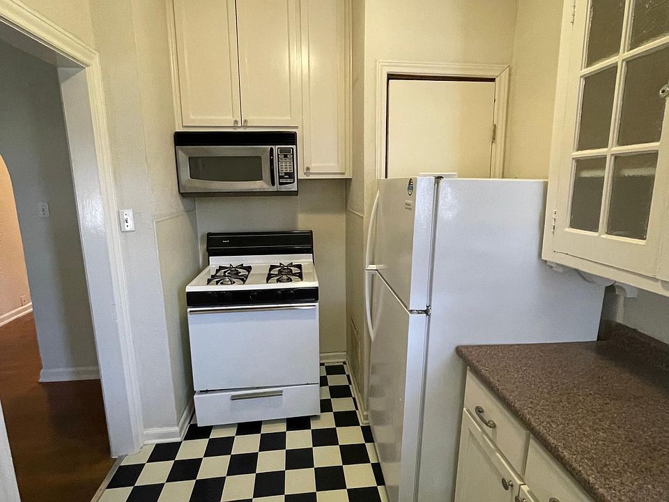 kitchen with gas stove and above the range microwave