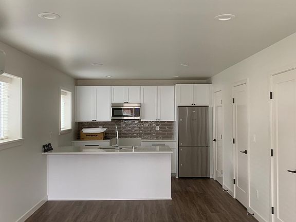 Living/Dining/Kitchen - Powder Room/Bath and Pantry to the right