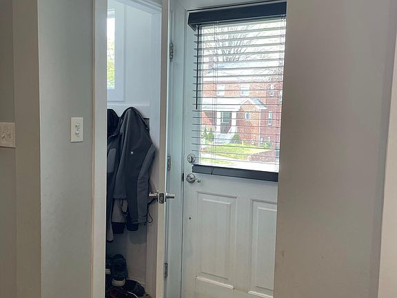 Entryway with sizable coat closet.