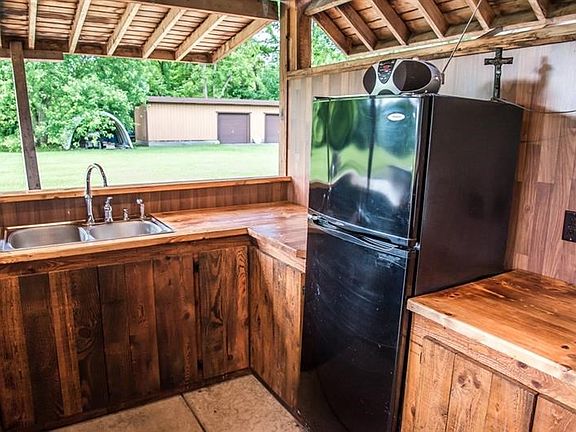 ~ Lights, Water, Electric, Fridge & Griddle Cook Top!  All Utensils & Prep Ware neatly stowed away behind the Bar are included. 