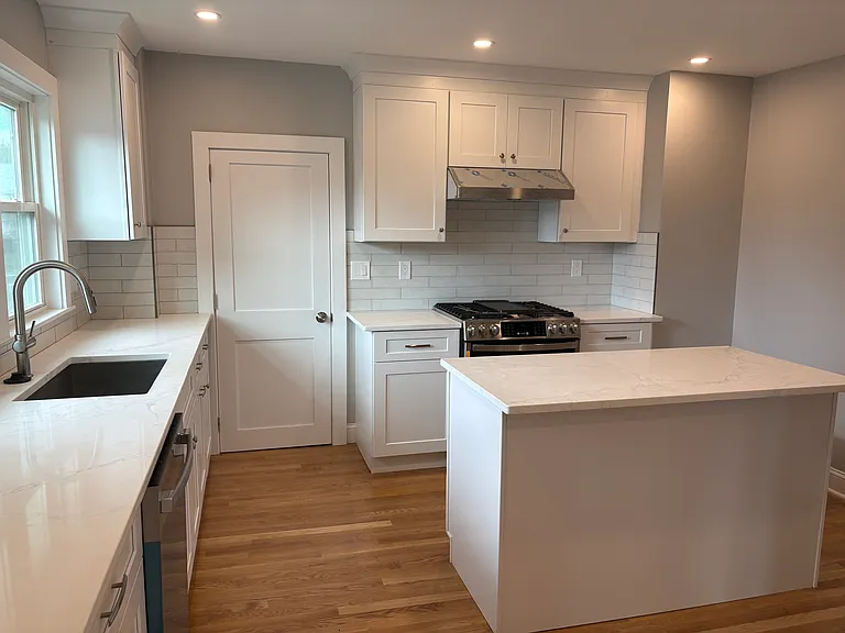 Kitchen - New hardwood floors, new cabinets, new countertops, new appliances, new windows, new doors, new insulation, new sheetrock, new electrical and Plumbing.