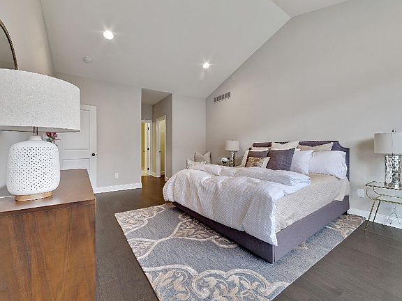Primary Bedroom Features Cathedral Ceiling