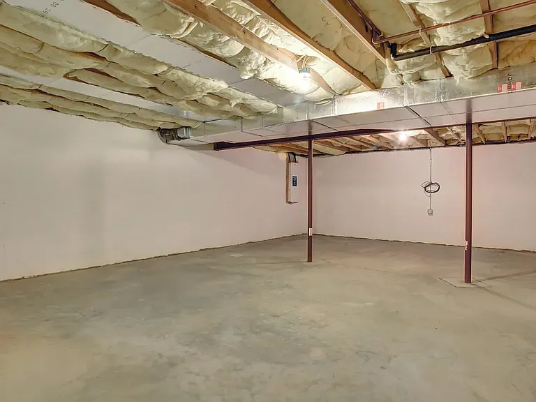 Large unfinished basement has 9 foot ceilings and would be great for storage, playroom, gym etc