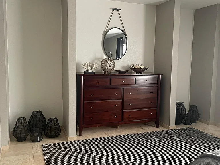 FURNISHED. Master Suite. Ample, with room for a king size bed plus seating chairs or bench.