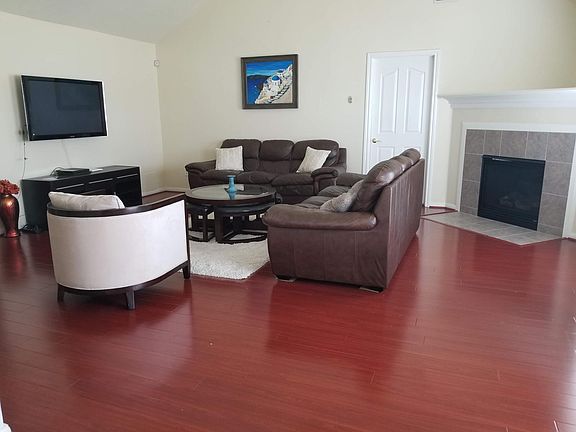 living room w/ laminate wood floors