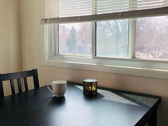 Dining room/Sun Room with three walls of windows