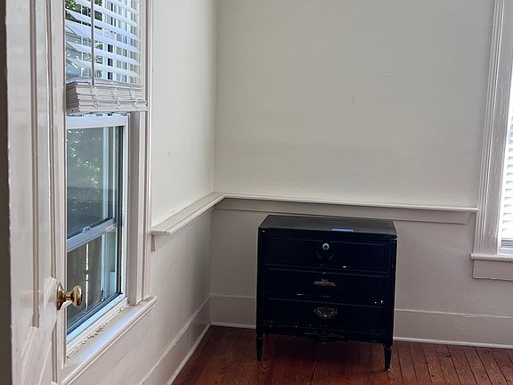 Front corner of front bedroom from entry hall. The bedroom is light and bright with great air circulation.