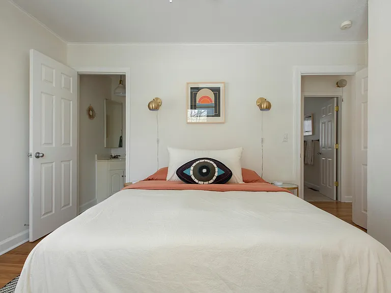 View of master with entrance on the right and small half bath on the left.