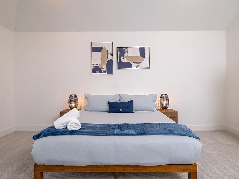 Primary bedroom has a king bed with extra towels and blankets available