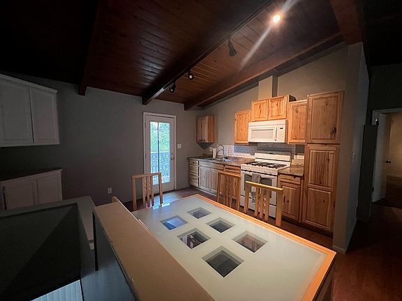 Kitchen open to dining.