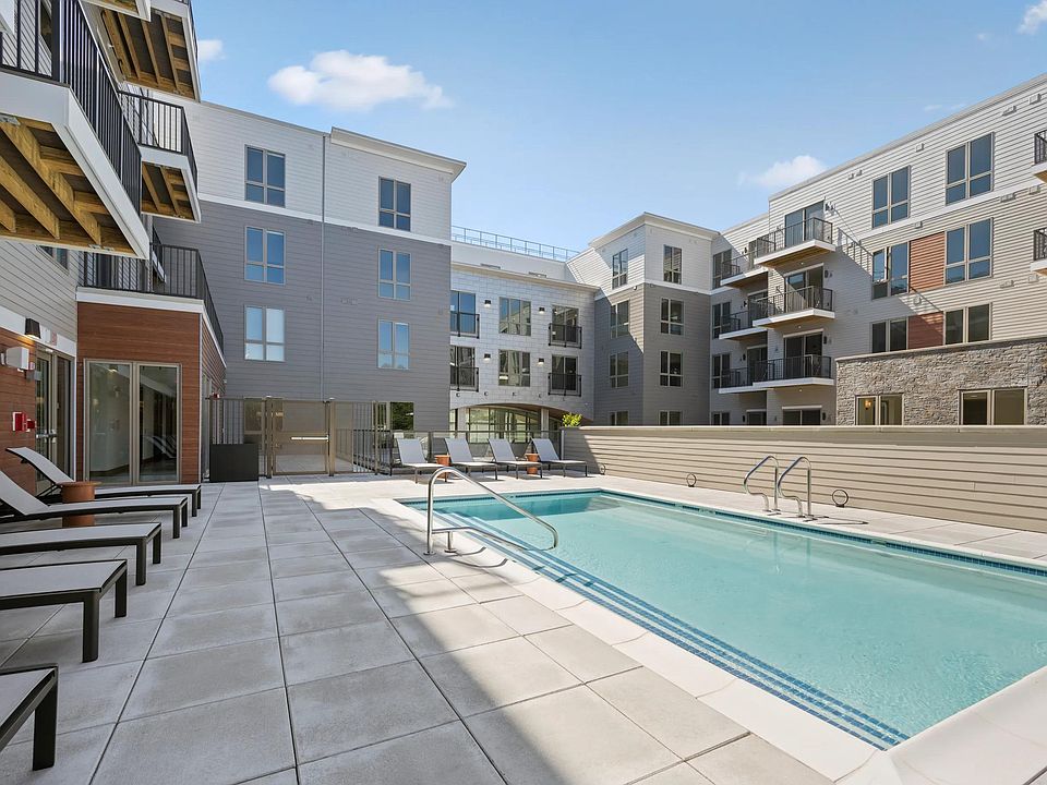 Relax poolside at Modera Newton in Newton, MA.