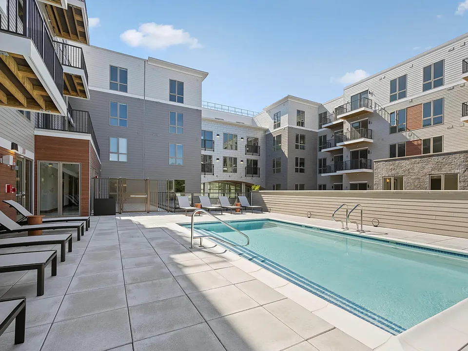Relax poolside at Modera Newton in Newton, MA.