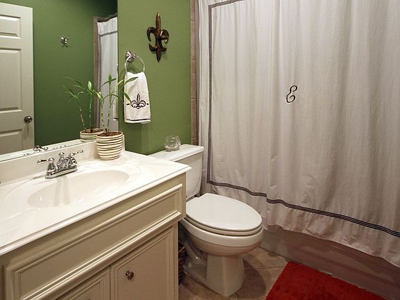 Guest bathroom with beautiful tile floors.
