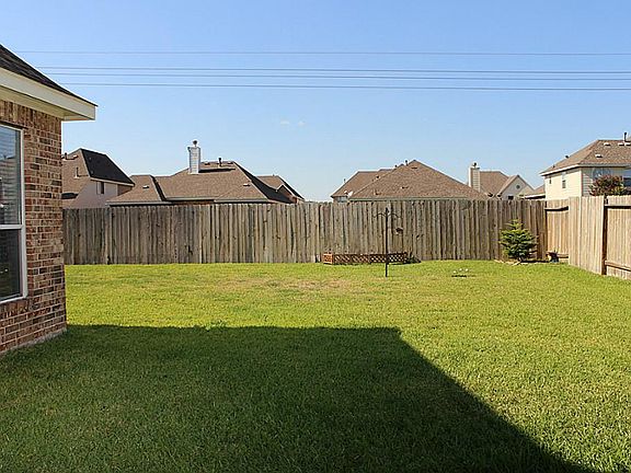View of the Large Backyard from the Patio Area.