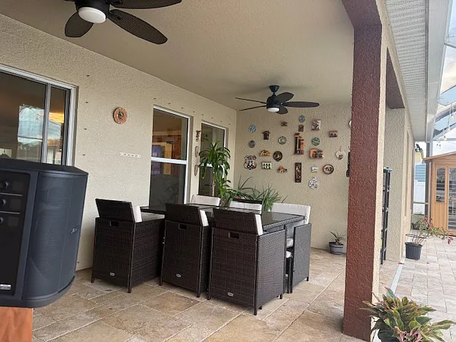Spacious covered patio with seating area_perfect for outdoor dining and entertaining.