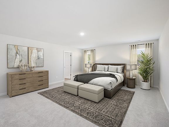 Primary bedroom in the Taylorsville floorplan at a Meritage Homes community in Garner, NC.