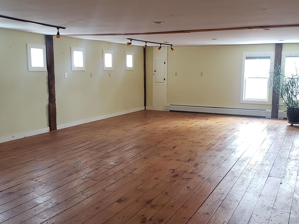 Wide pine floors and exposed beams