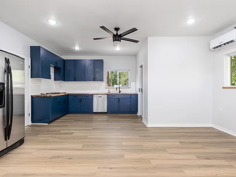 Brand new, full kitchen includes 5 burner stove, dishwasher, large sink, full sized fridge and beautiful butcher block counters.