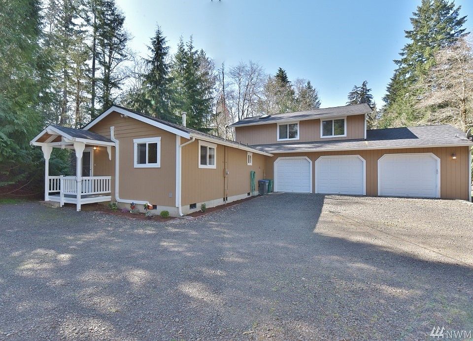 Pulling in to your new home with 3 car garage and circular drive way, with plenty of room to park 5th wheel or our RV