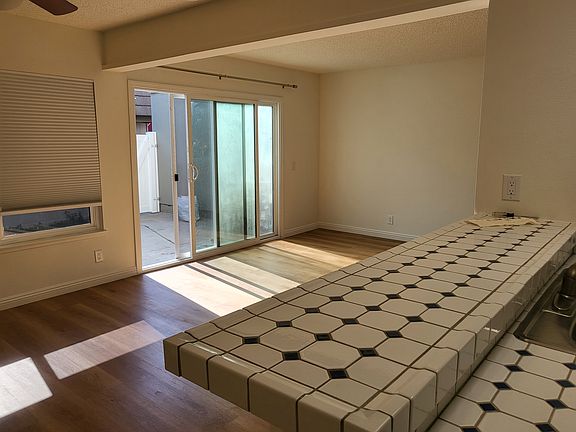 View of Dining area, living room & patio from kitchen