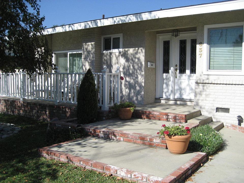Front of the house, set back from the street.