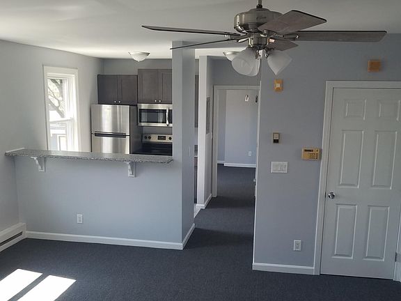 Living room looking into bar area and kitchen
