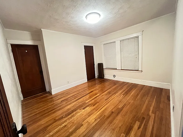 Middle Bedroom: Two doors on A wall -- left one facing stairway, right one is closet door