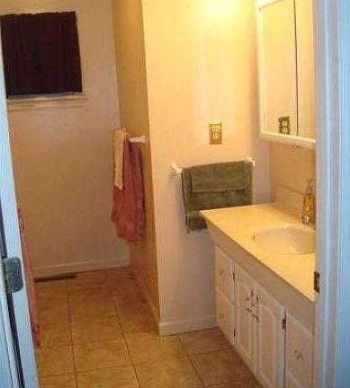 Full bathroom with tub