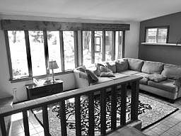 Great Room/Family Room with windows overlooking backyard