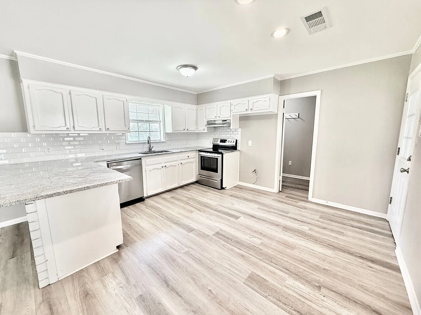 Bright & Spacious 3 Bedroom Brick Home with Double Carport & Large Backyard — Photo 2