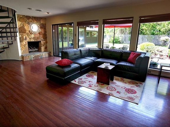 Beautiful wood flooring & big wall to ceiling windows letting in tons of natural light. Very open space.