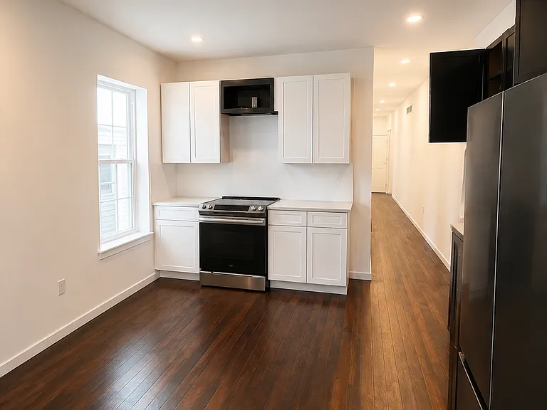 Spacious kitchen with updated cabinets and appliances.