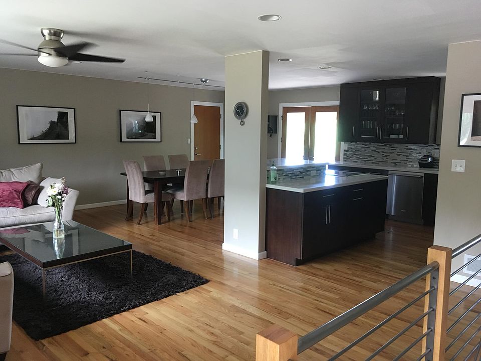 Open floor plan with living, dining, and kitchen