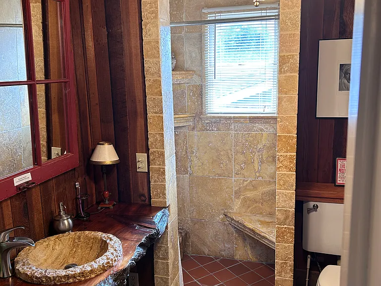 First floor bathroom with shower and bath tub.