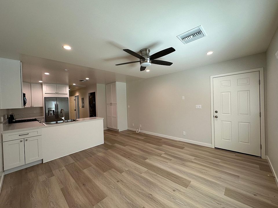 Living room and kitchen, indoor laundry.