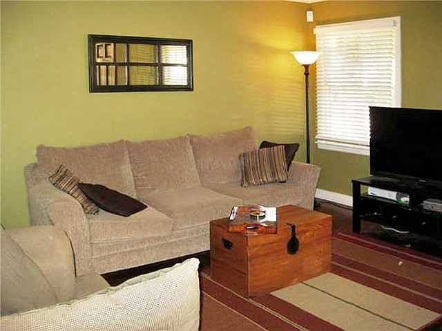 Living room has beautiful redone hardwood floors