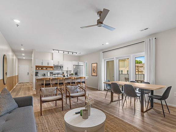 Open Living/Kitchen. staged similar unit. This one is NOT furnished.
